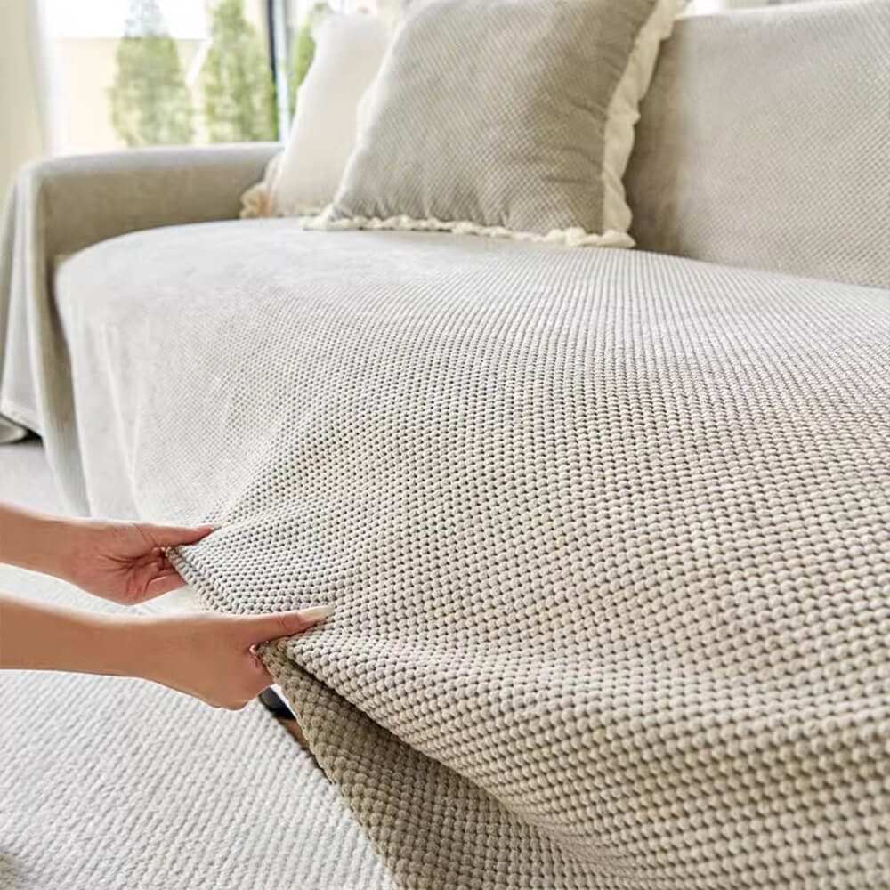 Funda de sofá de suave pana cálida con tejido de gofre.