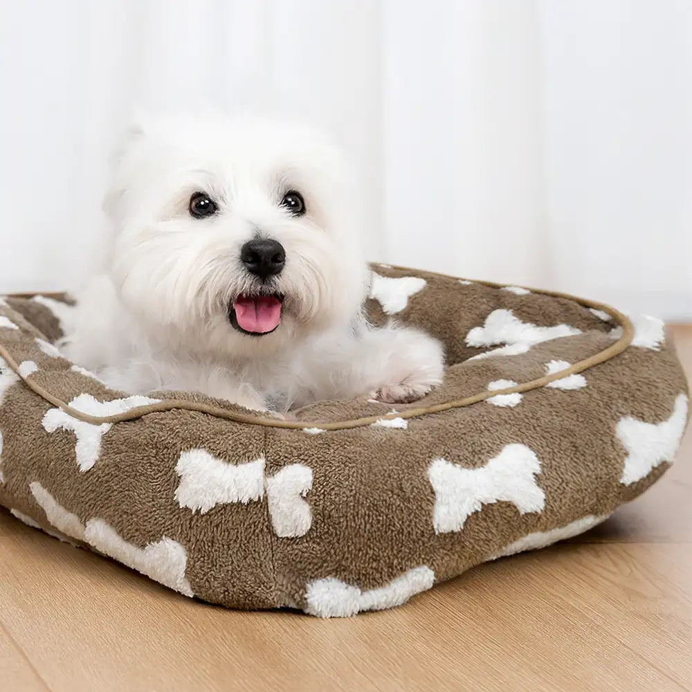 Cama para perros cuadrada de felpa con patrón de hueso y profundidad para dormir