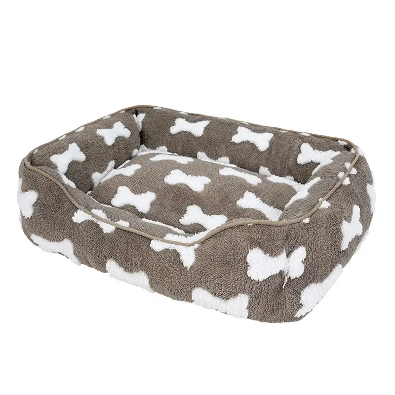 Cama para perros cuadrada de felpa con patrón de hueso y profundidad para dormir