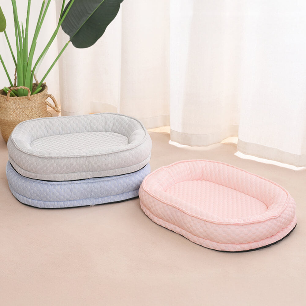 Cama para perro ovalada en forma de donut con comodidad refrescante elevada