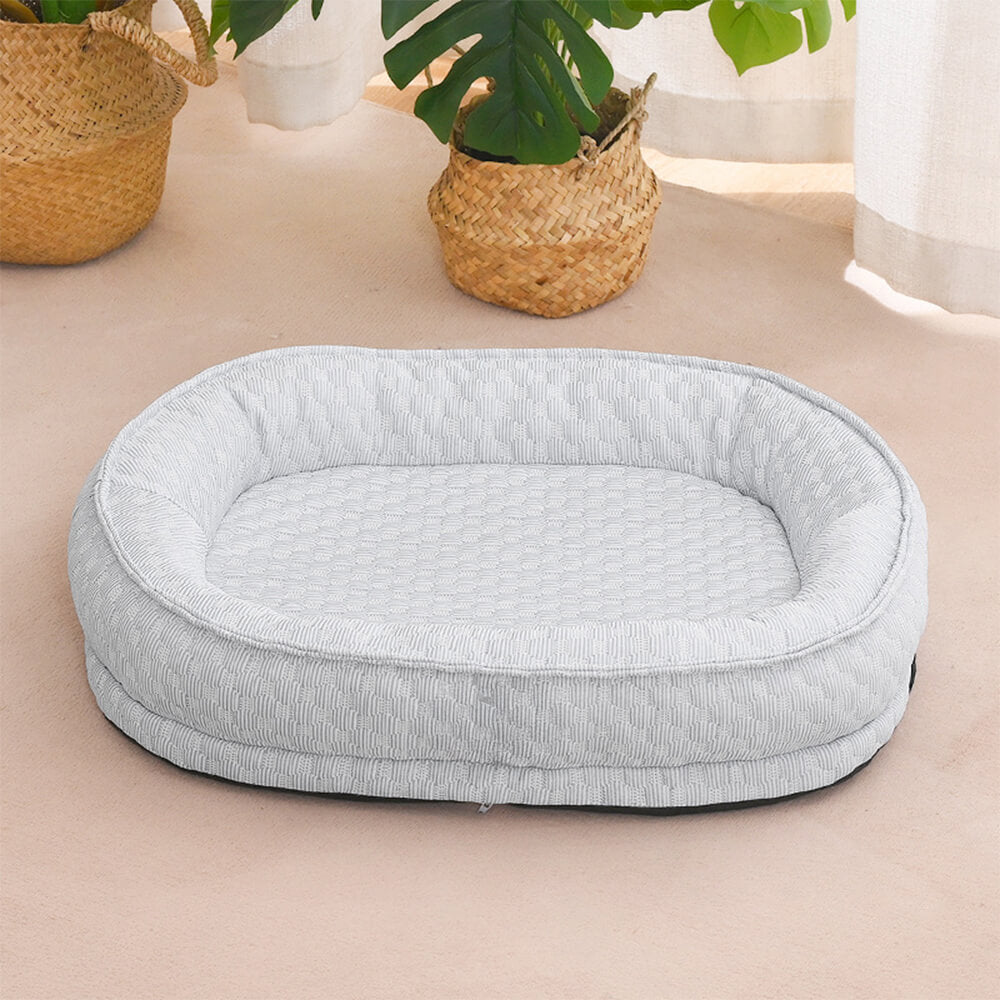 Cama para perro ovalada en forma de donut con comodidad refrescante elevada