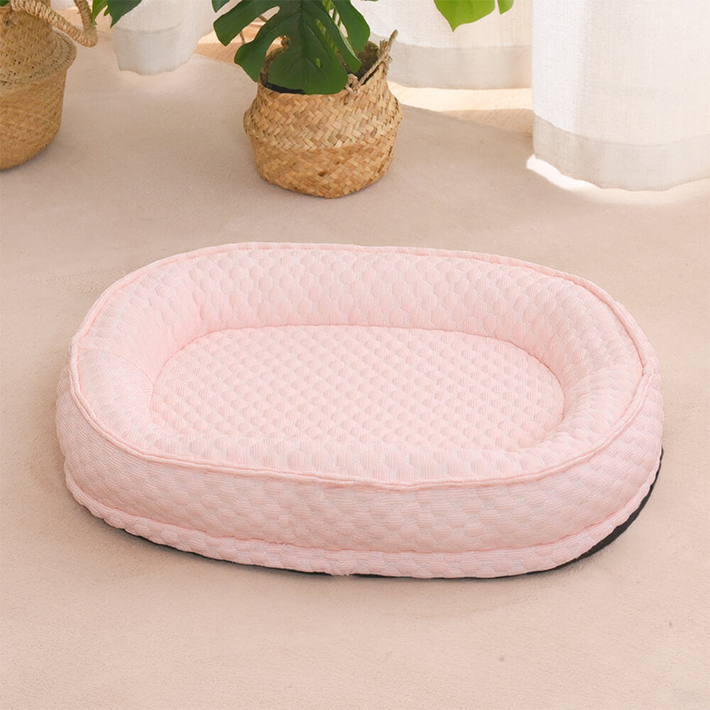 Cama para perro ovalada en forma de donut con comodidad refrescante elevada