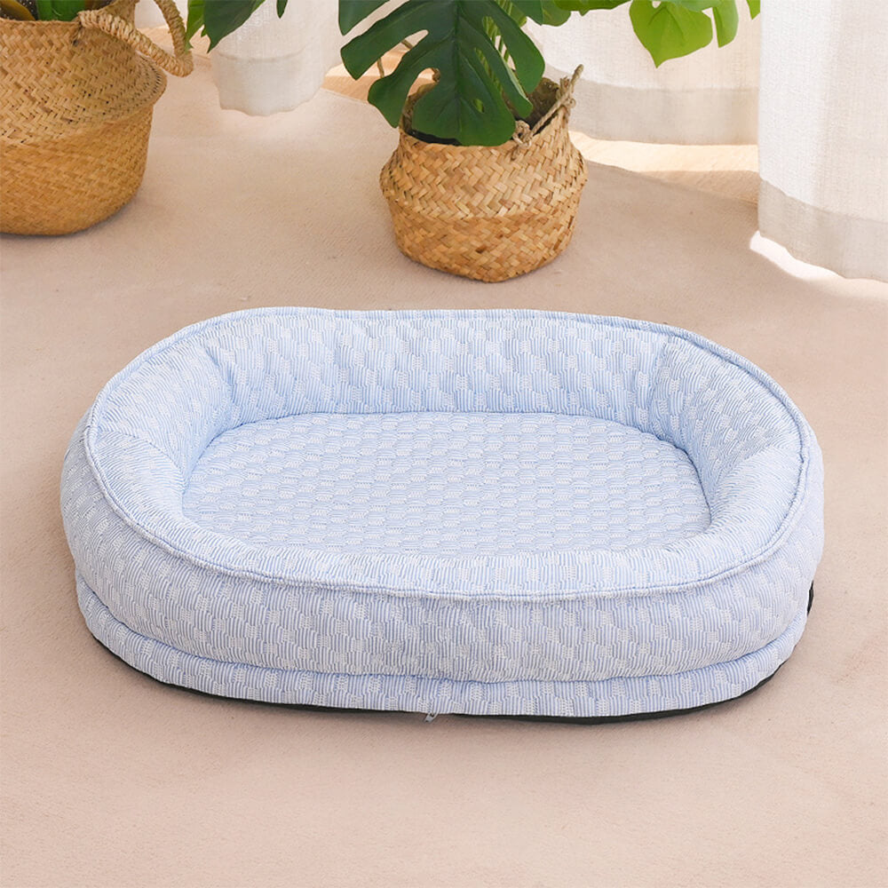 Cama para perro ovalada en forma de donut con comodidad refrescante elevada