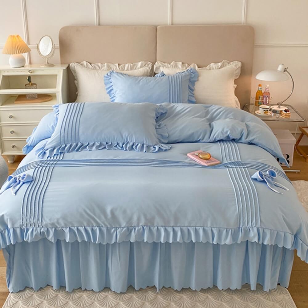 Elegante juego de sábanas de terciopelo color leche con decoración de lazo y faldón para cama