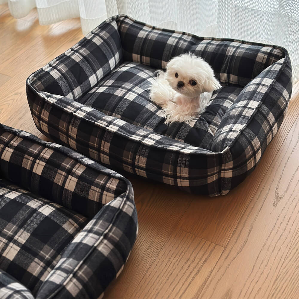 Cama para perros y gatos duradera y cálida con cuadros negros y soporte envolvente completo