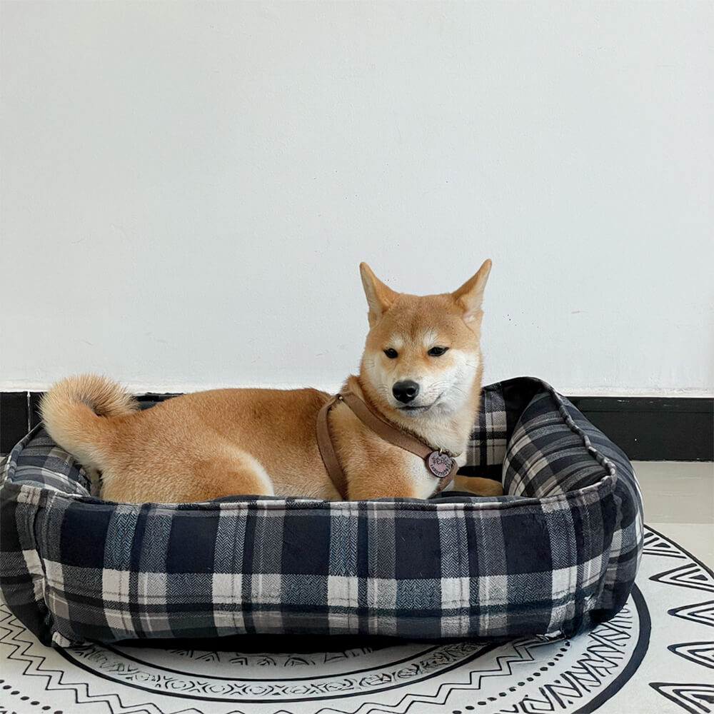 Cama para perros y gatos duradera y cálida con cuadros negros y soporte envolvente completo