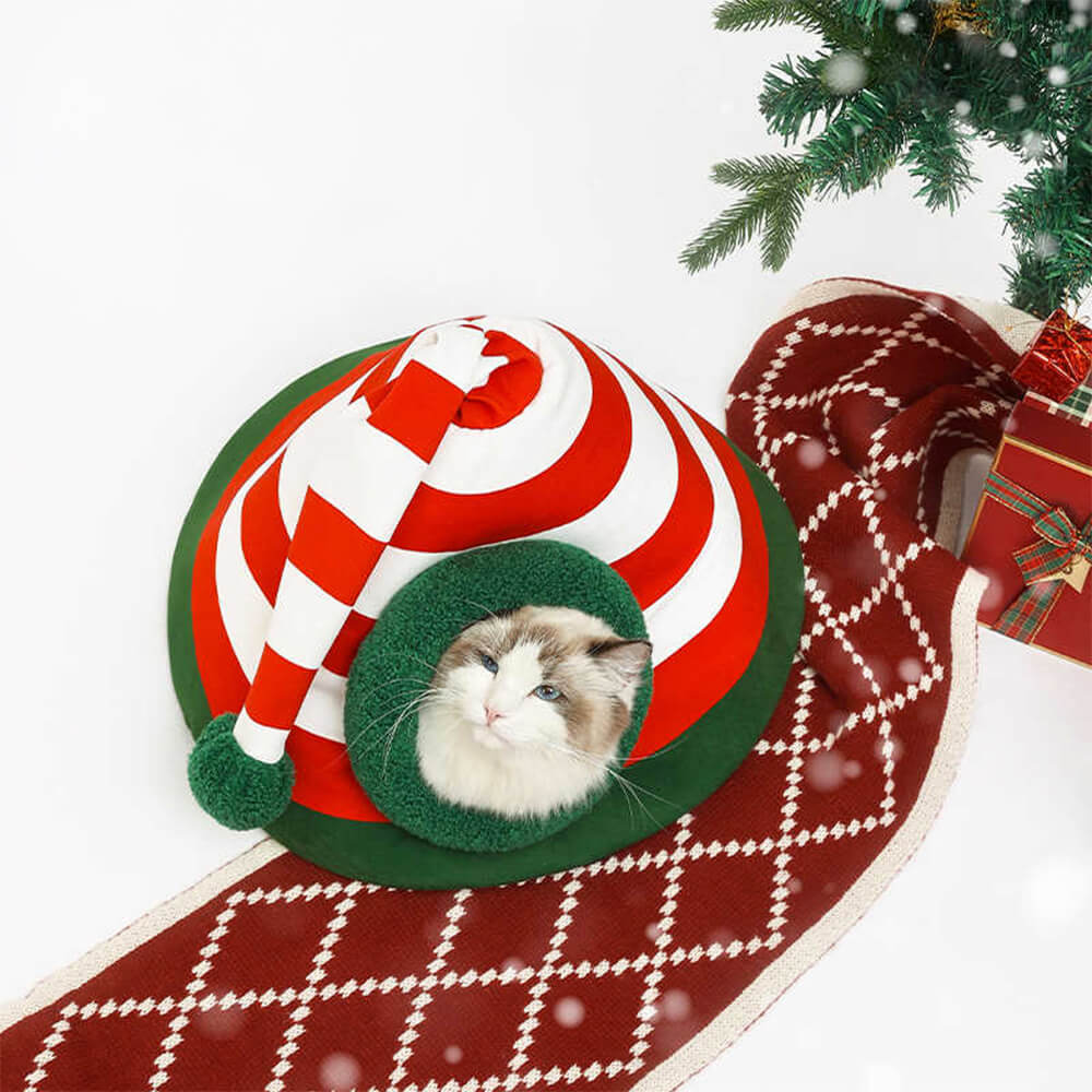 Cama cueva para gatos semicerrada, lavable y abrigada, con gorro navideño clásico