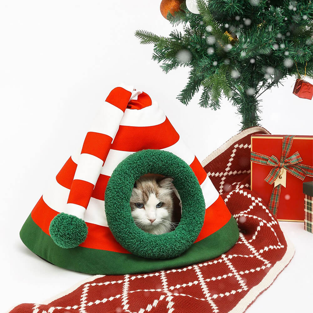 Cama cueva para gatos semicerrada, lavable y abrigada, con gorro navideño clásico