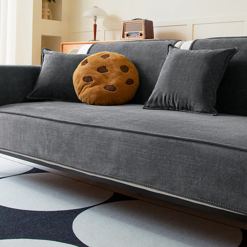 Funda protectora antideslizante para sofá de pana elegante